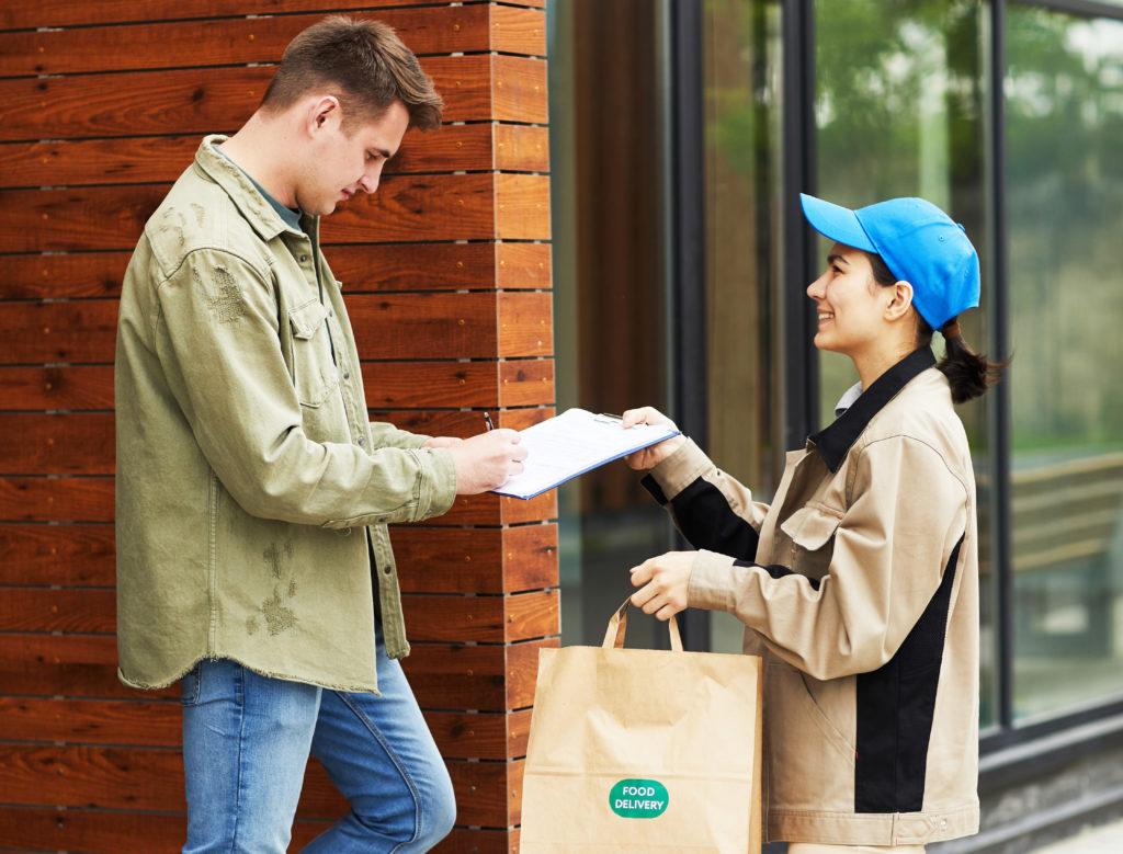 A man receiving a food delivery